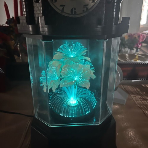 Table clock used collectible with lighting and rotating flower