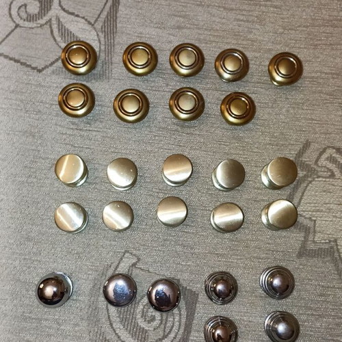 Handles and knobs for cabinets and drawers used, 24 pieces gold and silver