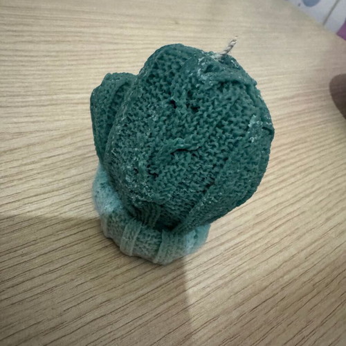 Green candle in glove shape new