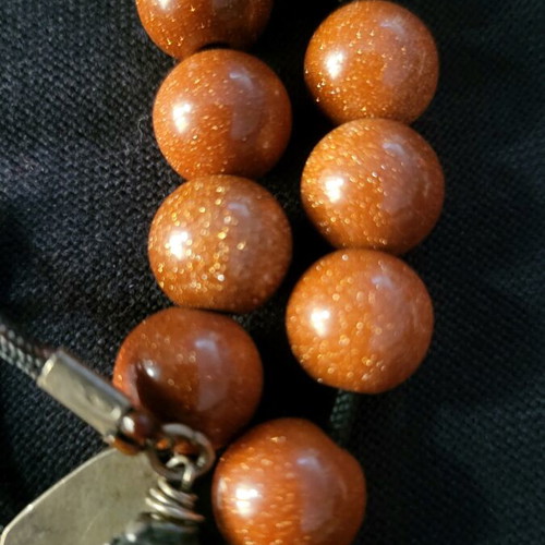 Komboloi made of goldstone and 925 silver like new