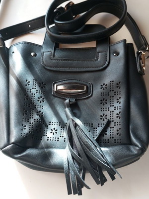 Black Women's Shoulder Bag like new with laser-cut patterns and tassels