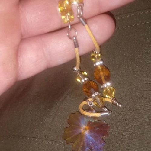 Handmade necklace with amber beads and leaf pendant