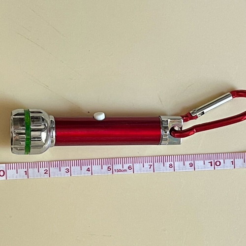 Keychain flashlight like new, requires 4 batteries