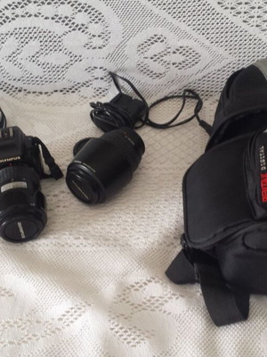 Olympus E-500 camera used with case, charger, and extra lens