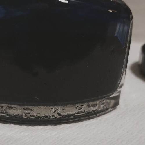 Permanent blue ink "PARKER - SUPER QUINK", in a glass bottle in its box, I think it is full.