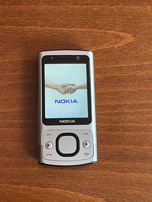 Nokia 6700s phone used with metal body and original battery