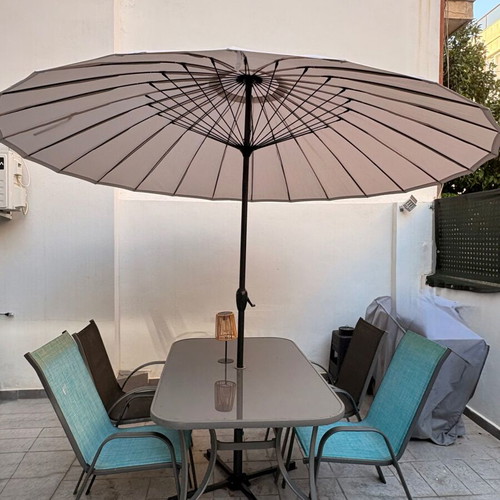 Garden dining set with glass table, umbrella and 4 chairs