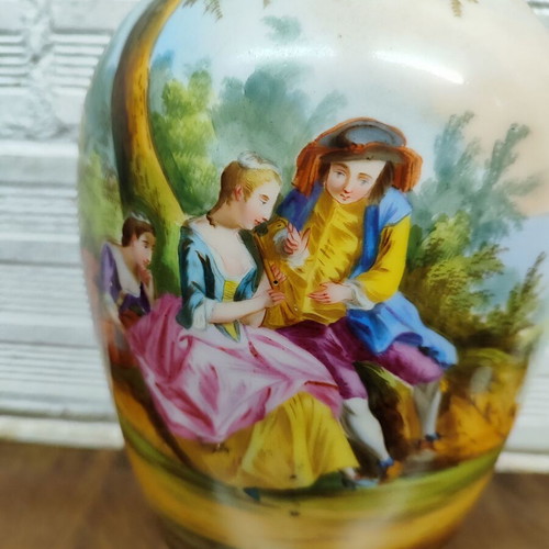 Old porcelain vase used, hand-painted with romantic scene