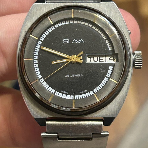 Slava mechanical wristwatch with 26 jewels like new, black and silver