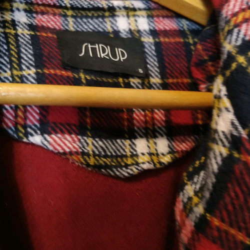 Checked coat size Small like new with belt and stitched pockets