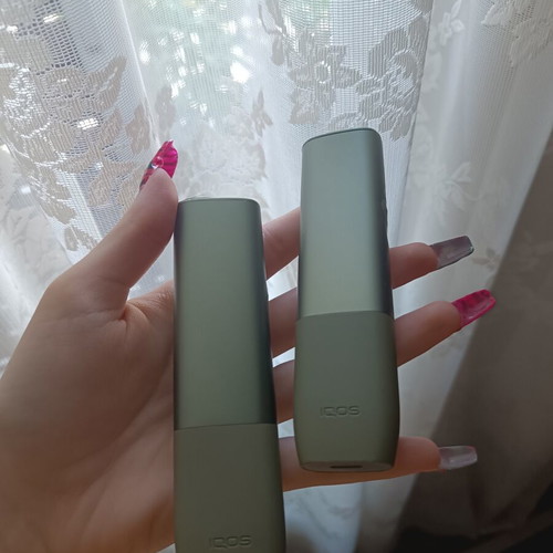 Iqos devices used, pack of two green with charger and brush