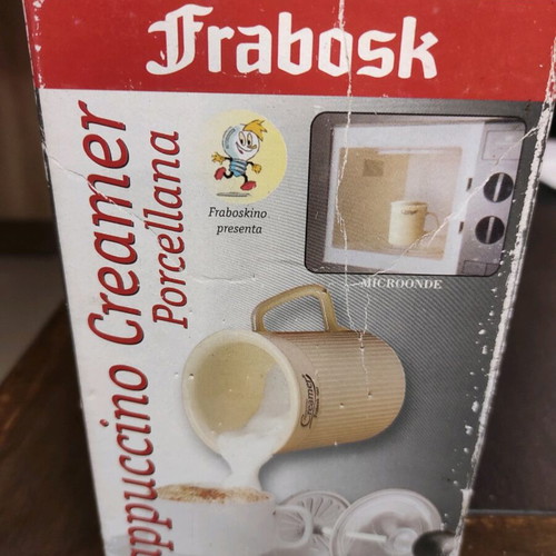 Cappuccino creamer used, porcelain