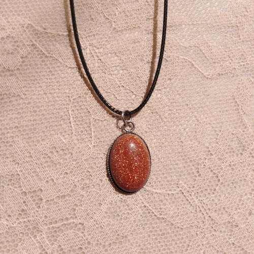 Handmade pendant with goldstone and steel cabochon new, brown