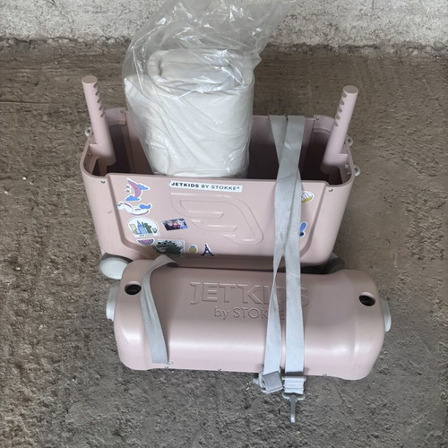 Stokke pink suitcase used with broken wheel part
