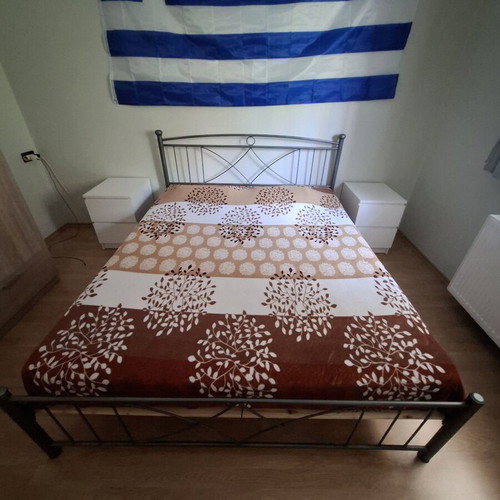 Double bed with metal frame and orthopedic mattress