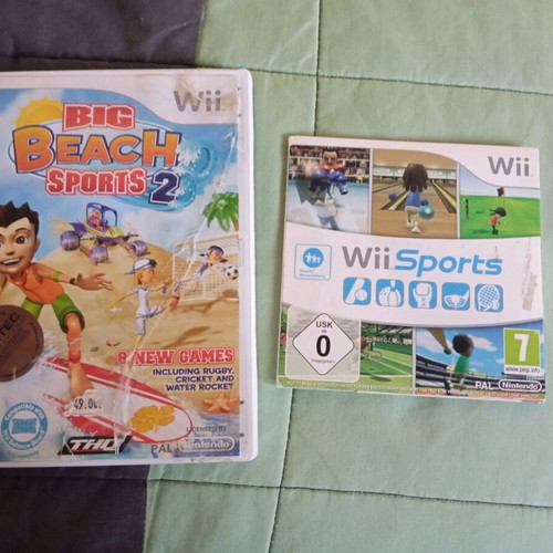 Nintendo Wii black used with Wii Motion Plus controller, nunchuk and 2 games
