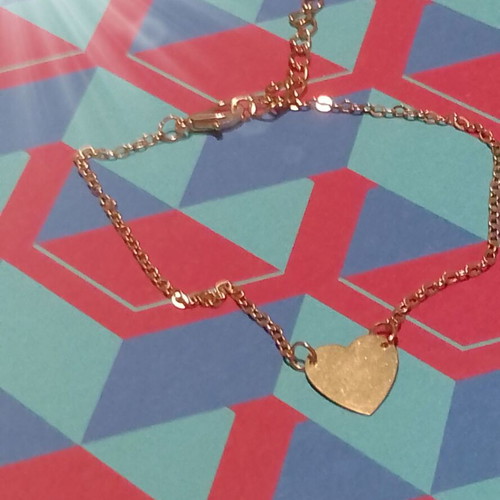 Gold-colored heart bracelet with chain