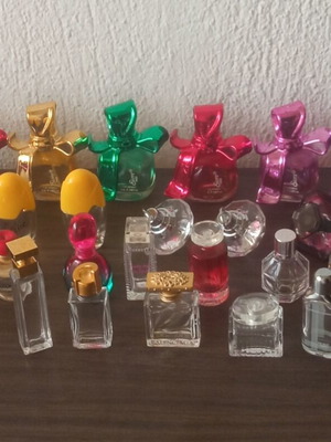 Collection of 29 empty perfume miniatures like new