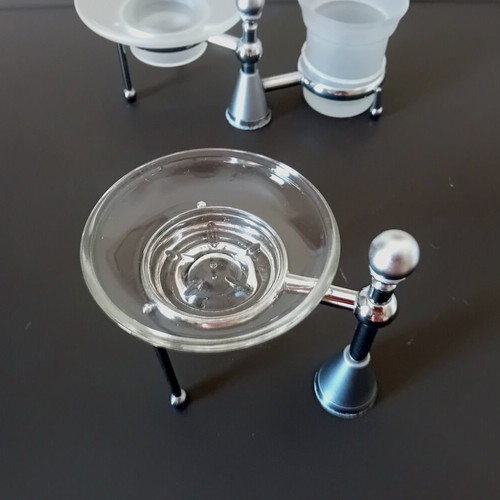 Two sets of inox bathroom accessories with glass and frosted parts
