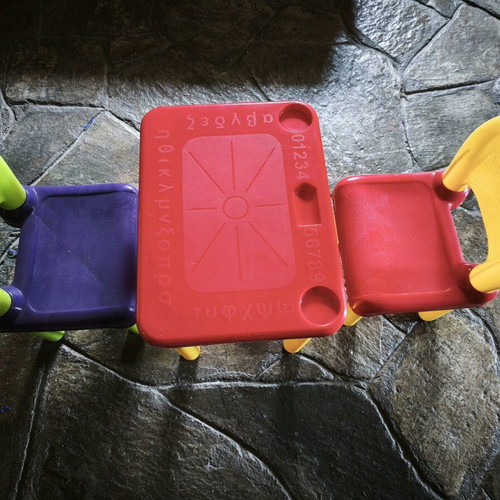 Children's table with two plastic chairs used