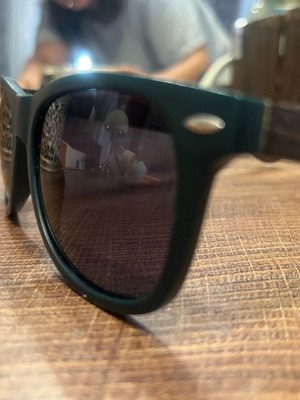Jägermeister collectible sunglasses with bamboo arms, dark green frame