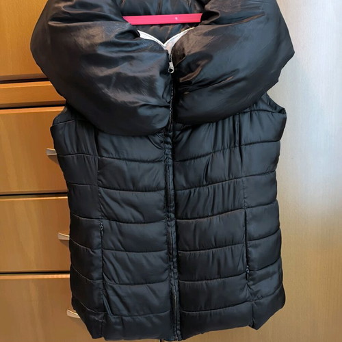 Black sleeveless Spell jacket size medium like new with bow at back