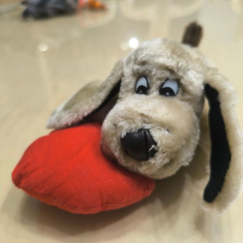 Plush dog with red heart like new
