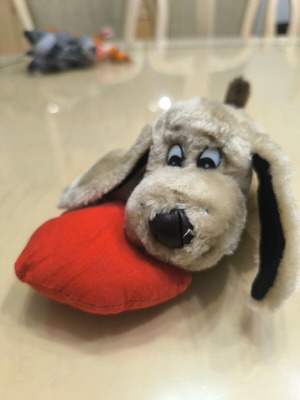 Plush dog with red heart like new