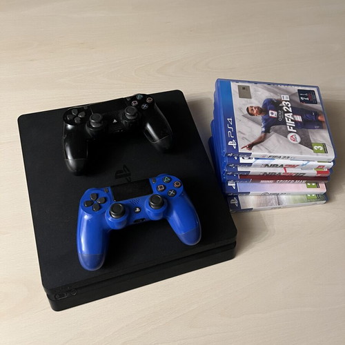 PS4 Slim 500GB console with 2 controllers and 6 games