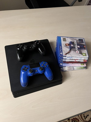 PS4 Slim 500GB console with 2 controllers and 6 games