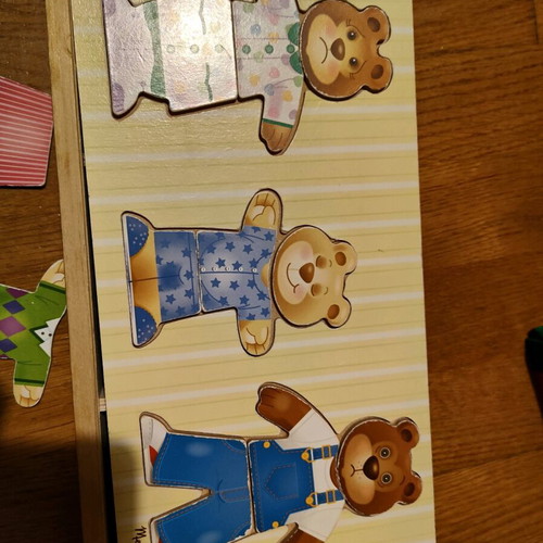 Melissa and Doug wooden puzzle like new with 3 figures and clothes