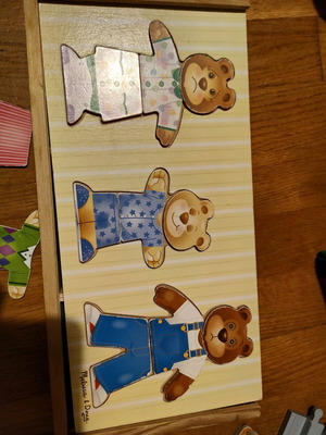 Melissa and Doug wooden puzzle like new with 3 figures and clothes