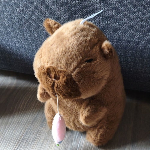 Capybara plush toy with pull carrot, like new
