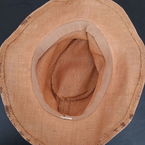 Straw-like hat used, tan with marks