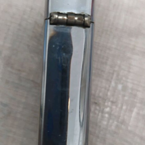 Zippo lighter used with small dent