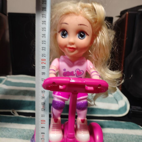Doll with scooter, sound and lights, like new