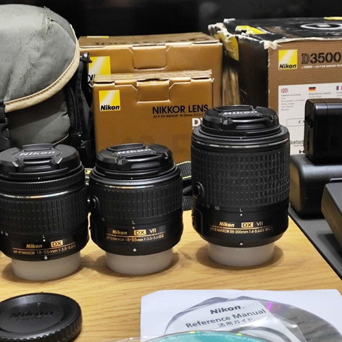 Nikon D3500 DSLR camera body with 3 lenses and accessories