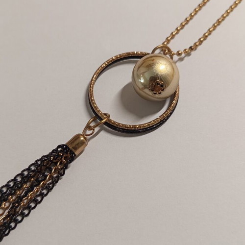 Long statement necklace like new, black and gold tassel pendant