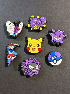 Pokémon Crocs Charms set like new, multicolored and purple