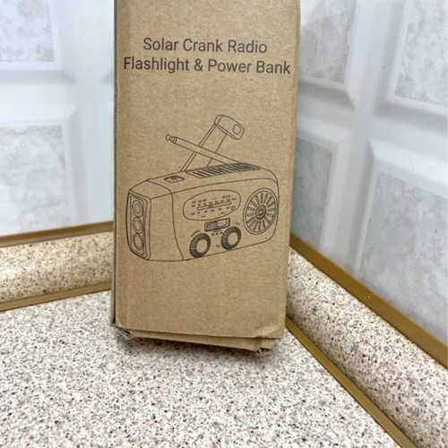 Multifunctional Emergency Gadget with FM Radio, Powerbank, Solar and Hand Charging, Flashlight