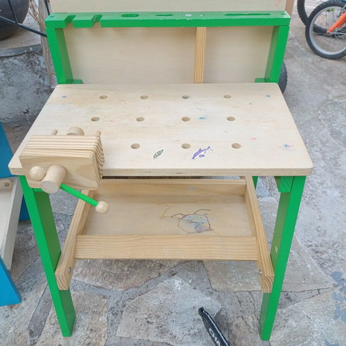 Children's wooden workbench used with tools