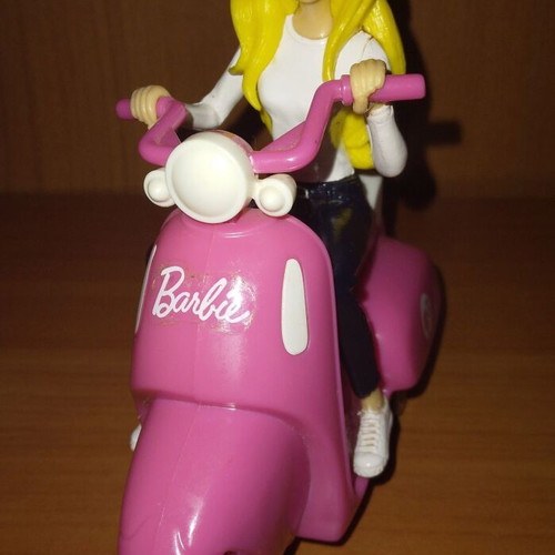Barbie figure on motorcycle used with motion