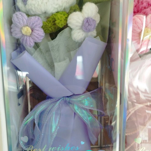 Artificial flower bouquet like new with knitted flower and plastic leaves