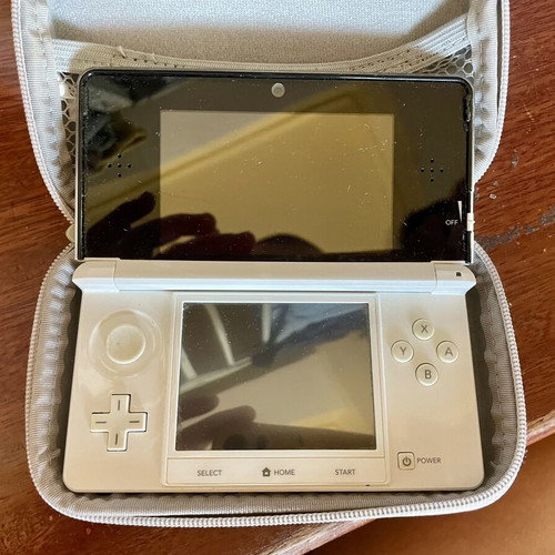 Nintendo 3DS white console with charger and case