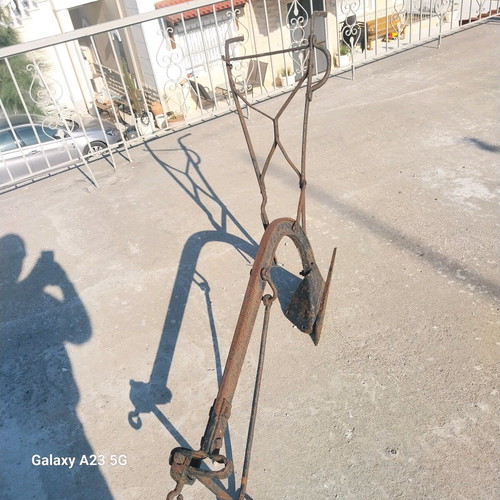 Plow used iron tool from 1940s for soil cultivation