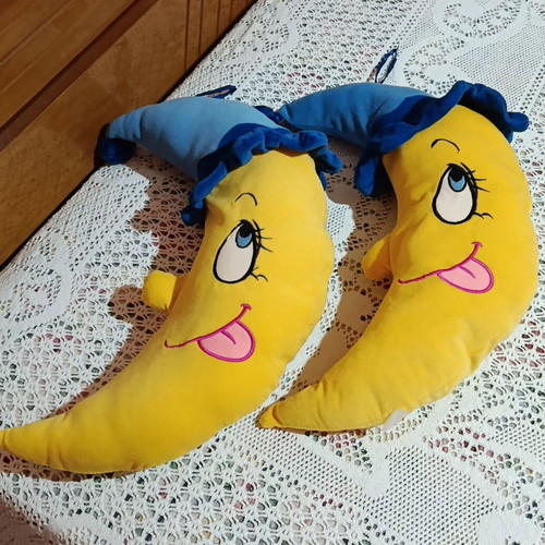 Set of 2 plush moon pillows used for kids' room decor