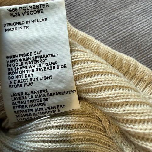 Zini sweater with high turned collar in cream color like new