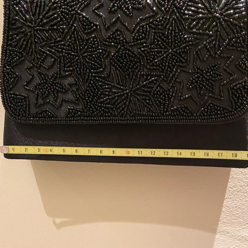 Mini black handbag like new with beaded embossed design