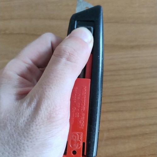 Utility knife with blade and spring used