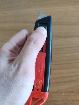 Utility knife with blade and spring used